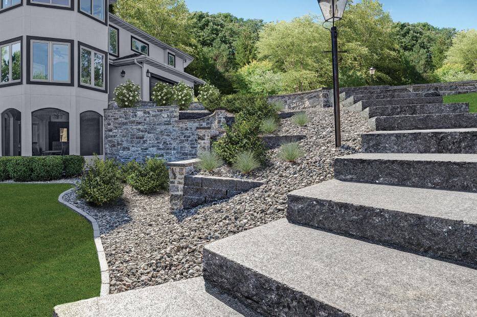 Large stone steps curl down a decline from a driveway to the backyard.