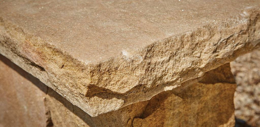 A closeup photo of a Harvest Gold Sandstone cap.