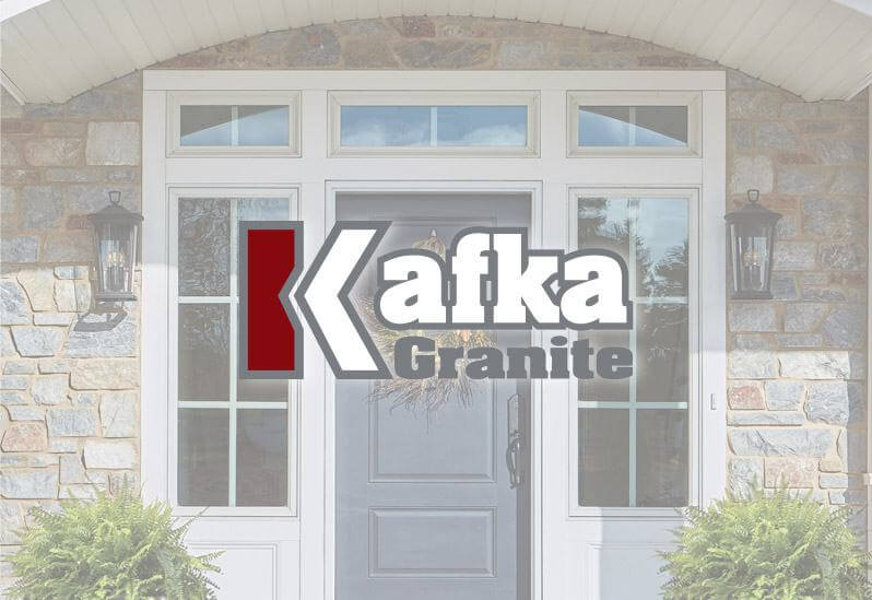 The Kafka Granite logo is imposed on top of a cloudy image of a front porch featuring Kafka's Thin Stone Veneer.