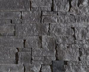 A picture of dark-colored dimensional drystacked Starlight Black Granite veneer.