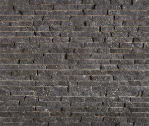 A picture of long, thin Starlight Black Granite stacked uniformly.
