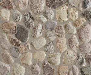 A close up of a stone facade with rounded Wisconsin Fieldstone