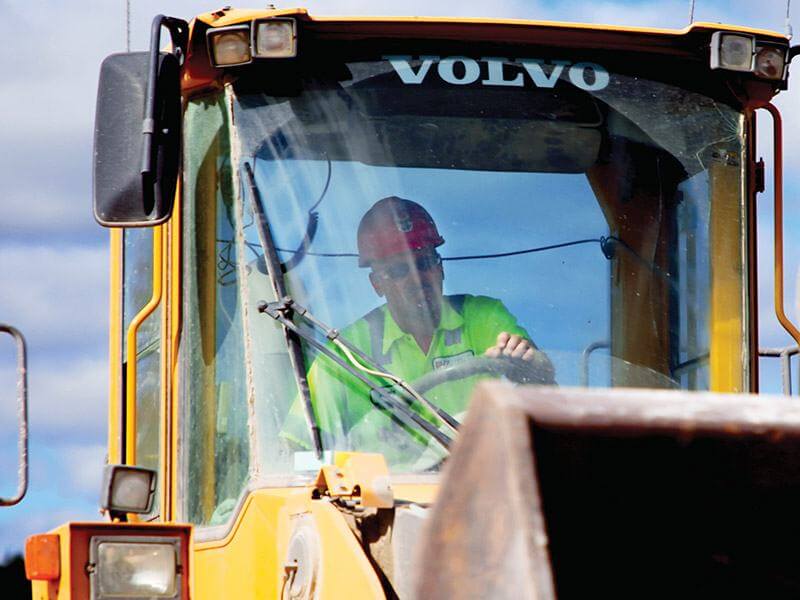 Kafka employee operating a front-end loader