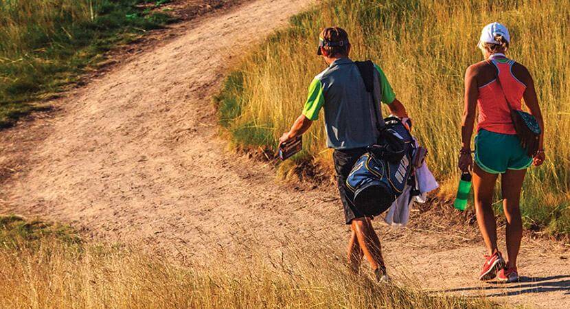 Golfers on path at Erin Hills golf course