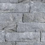 A zoomed in picture of neatly stacked Imperial Gray Granite.