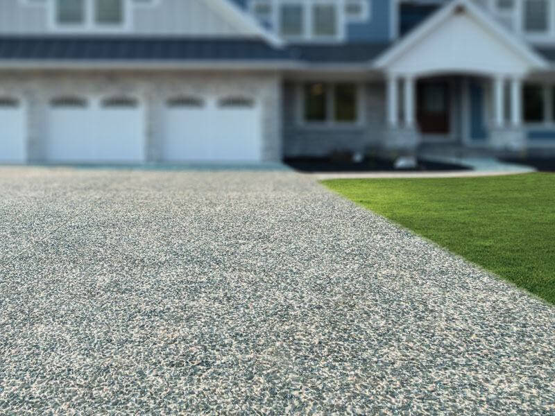 Exposed concrete aggregates in a driveway