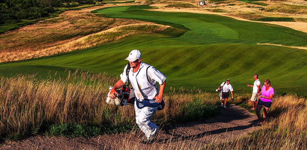 Golfers are shown walking on a Wax Polymer Stabilized Pathway Mix from Kafka Granite.