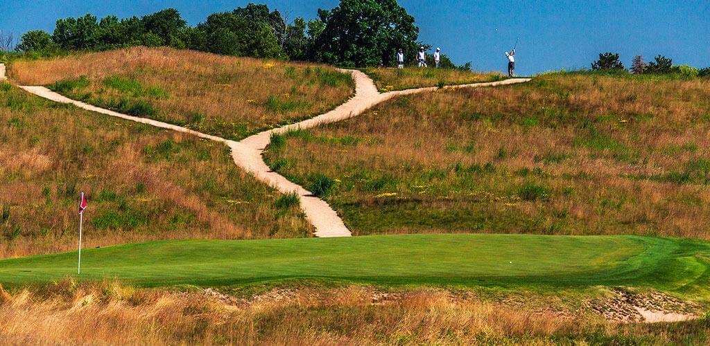 The Erin Hills golf course is shown with beautiful wax polymer pathway mix connecting all of the holes.