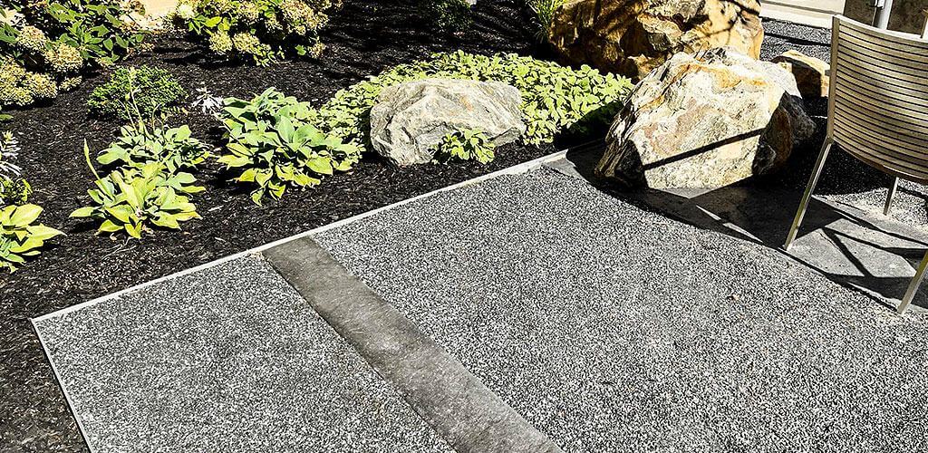 A custom combination of Starlight Black Granite, Salt & Pepper Granite, and Snow White Granite Stabilized Pathway Mix is shown on the campus of the American Greetings Headquarters.