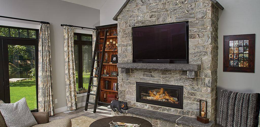 A fireplace features beautiful Thin Stone Veneer.