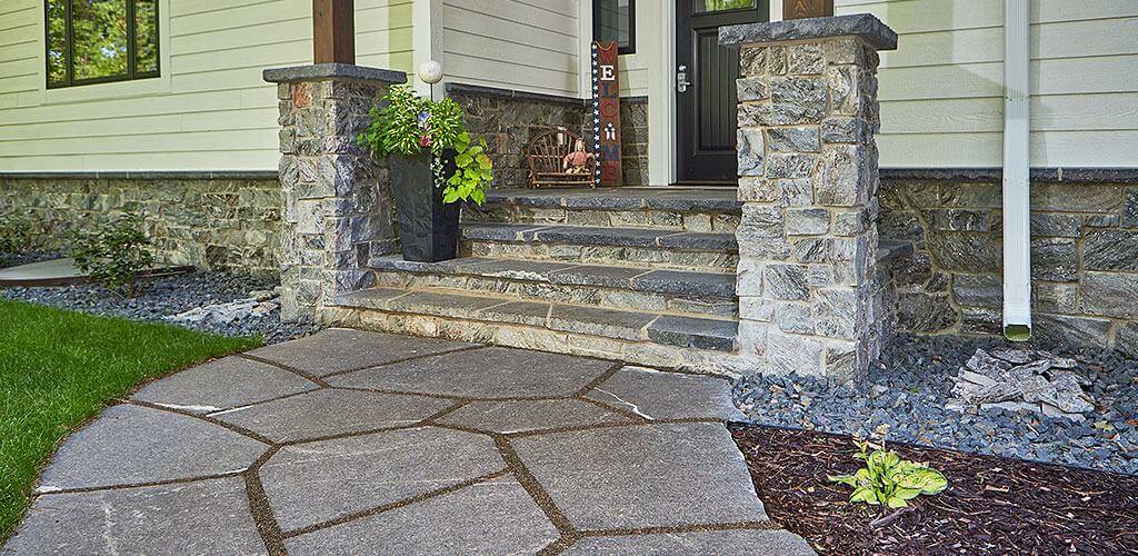 A home's front entrance is shown using Galaxy Glitter Thin Stone Veneer.