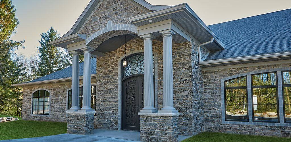 Galaxy Glitter Dimensional Thin Stone Veneer is used on the grand entrance of an impressive executive residence.