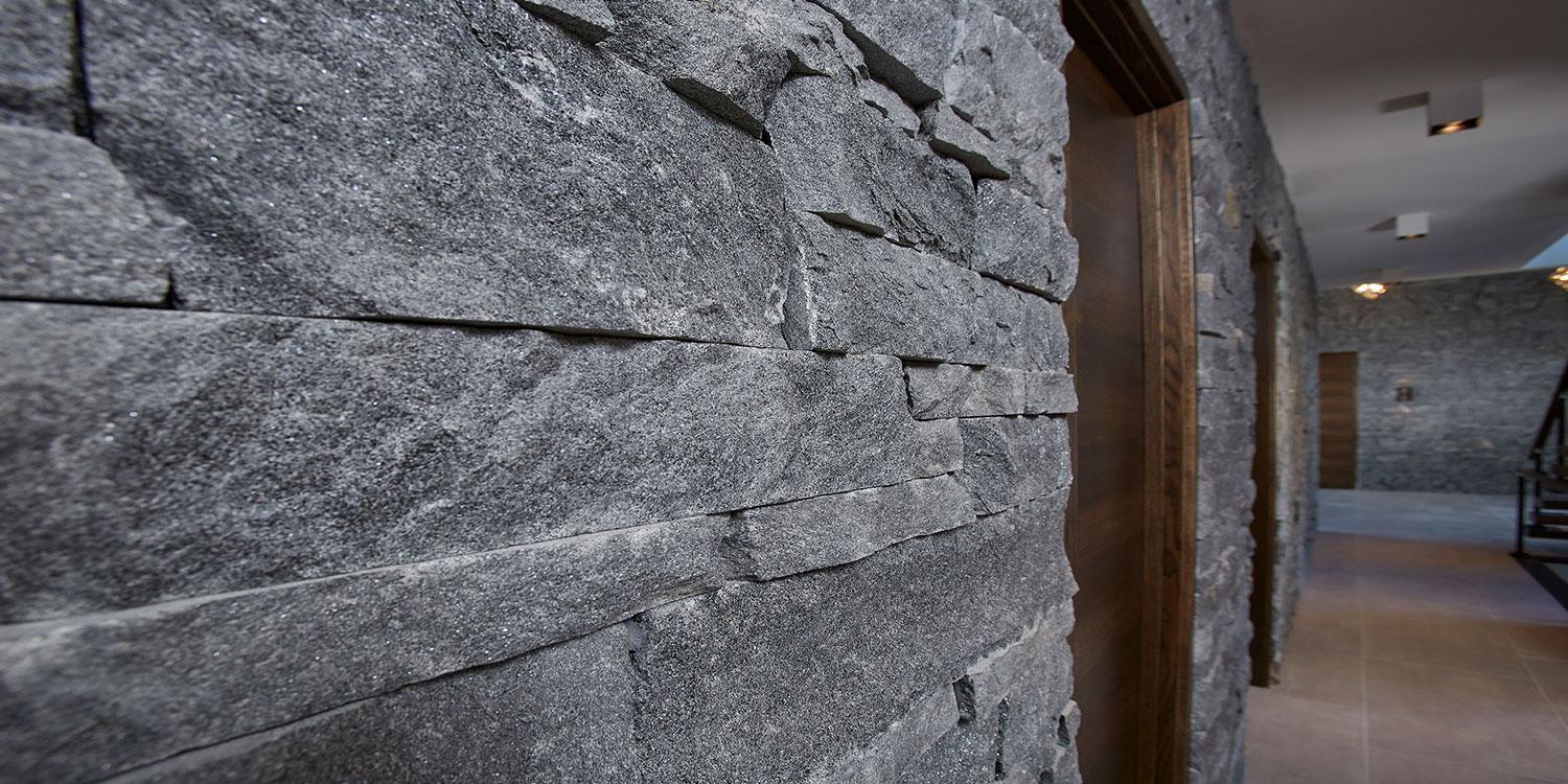 Kafka's Ebony Glitter Dimensional Drystack Thin Stone Veneer walls and fireplace accents