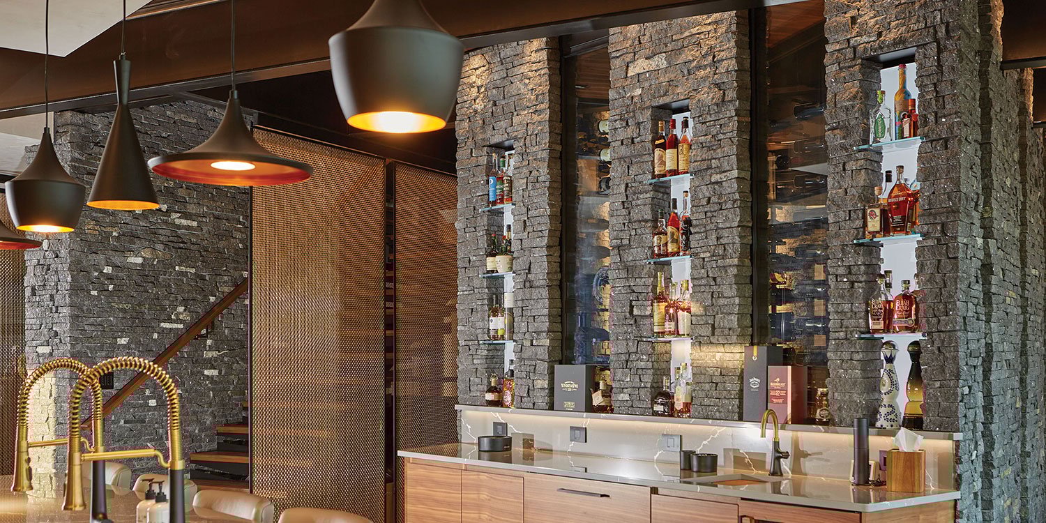 Kafka's Starlight Black Ledgestone Thin Stone Veneer featured in a custom wine cellar and accent walls